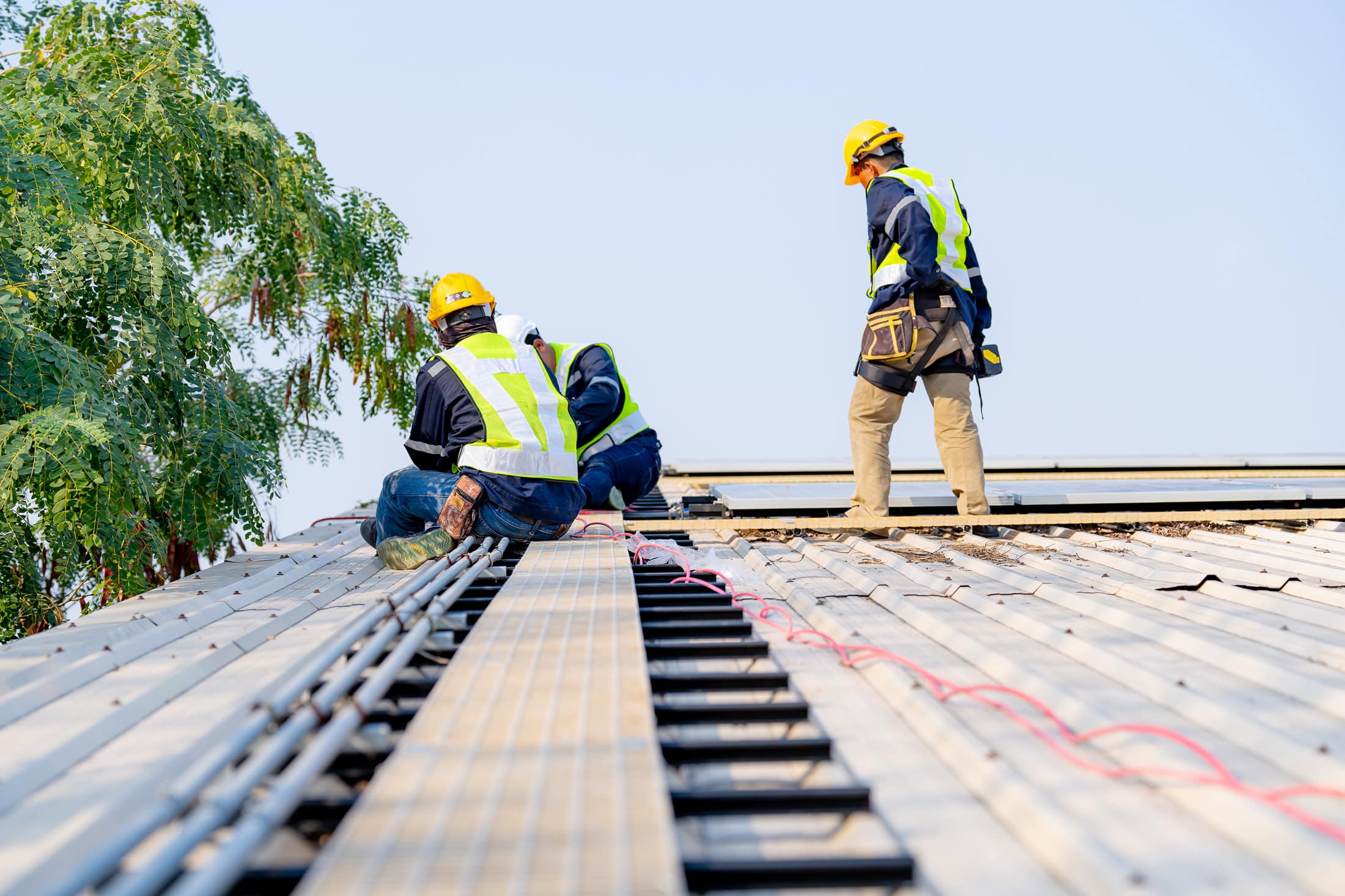 Nashville Roofing Company roofers inspecting and repairing a roof in Middle Tennessee